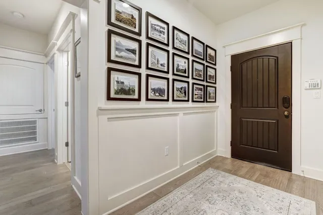 front view of an entryway with wooden floor