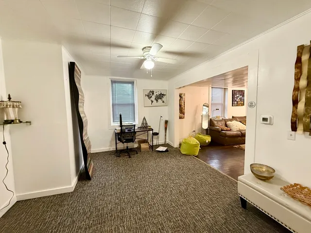 a living room with furniture and a rug