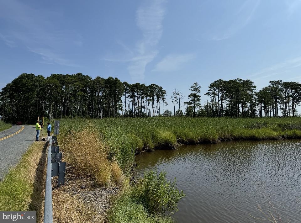 a view of a lake with a yard