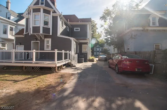 a couple of cars parked in front of a building
