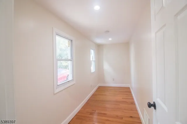 a view of a hallway with windows