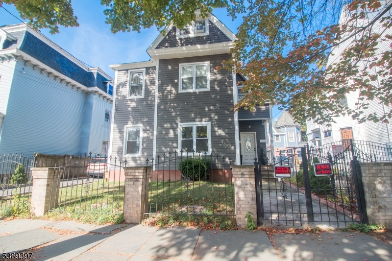 187 Littleton Avenue, Unit 1 Newark, NJ 07103 - Photo 22 of 22 a front view of a house with a porch
