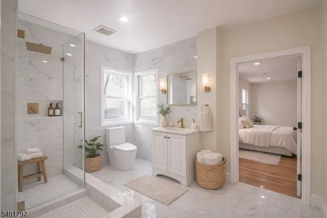 a bathroom with a toilet sink and shower