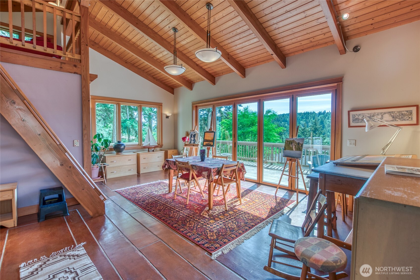 402 Cayou Valley Road Orcas Island, WA 98245 - Photo 30 of 40 a dining room with furniture a rug and wooden floor