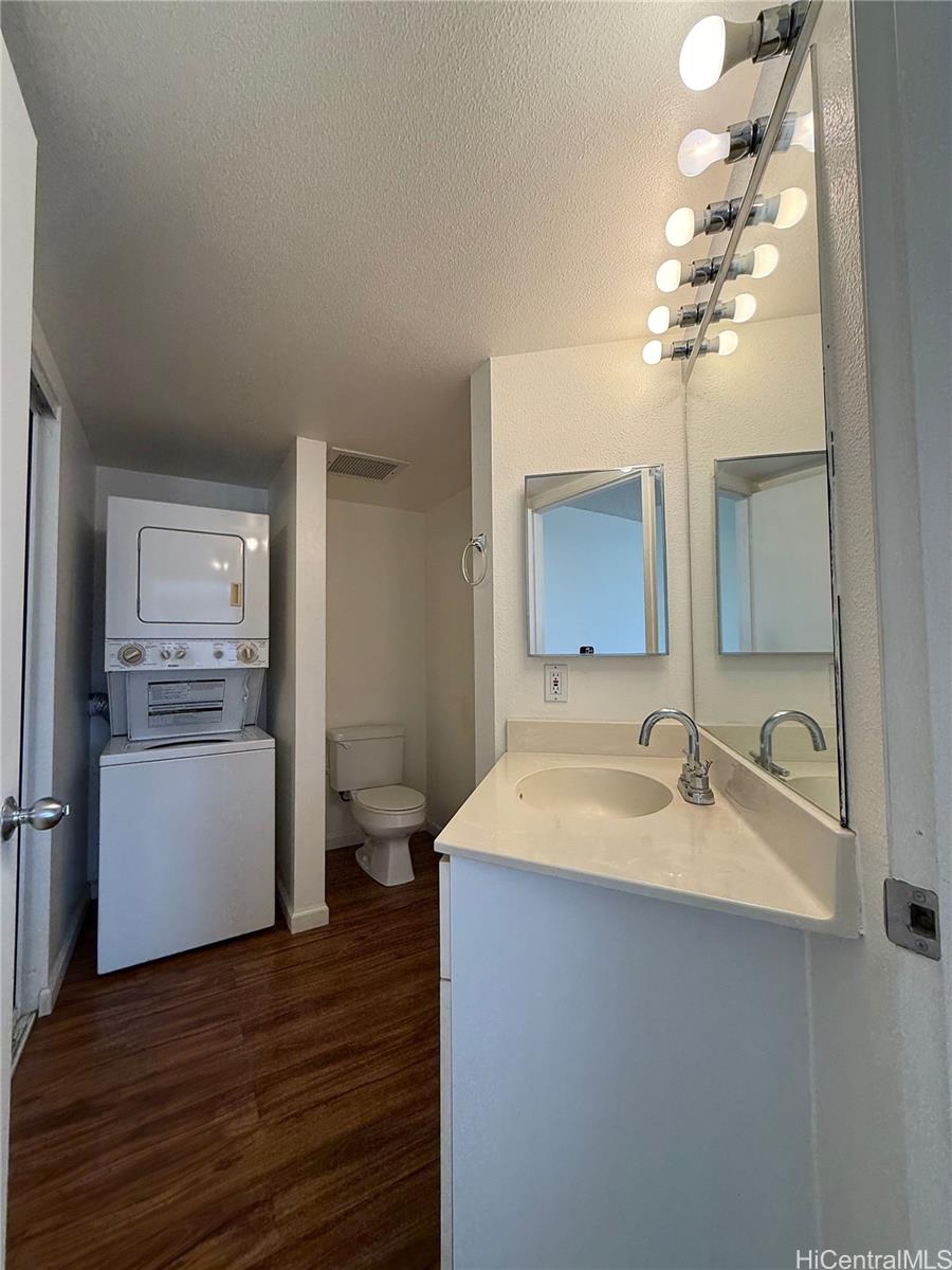 91-1199 Kaneana Street, Unit 2D Ewa Beach, HI 96706 - Photo 11 of 12 a bathroom with a sink and a mirror