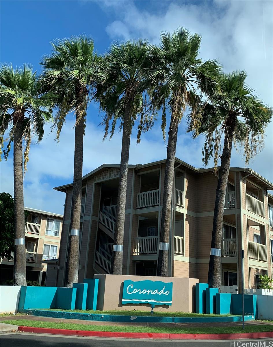 91-1199 Kaneana Street, Unit 2D Ewa Beach, HI 96706 - Photo 12 of 12 a front view of multi story residential apartment building with yard and green space