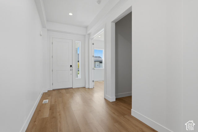 538 North Legend Circle, Unit 505 Mapleton, UT 84664 - Photo 7 of 48 Recessed ceiling lighting, light wood-finish flooring, white walls, white paneled door, and a full-length sidelite window