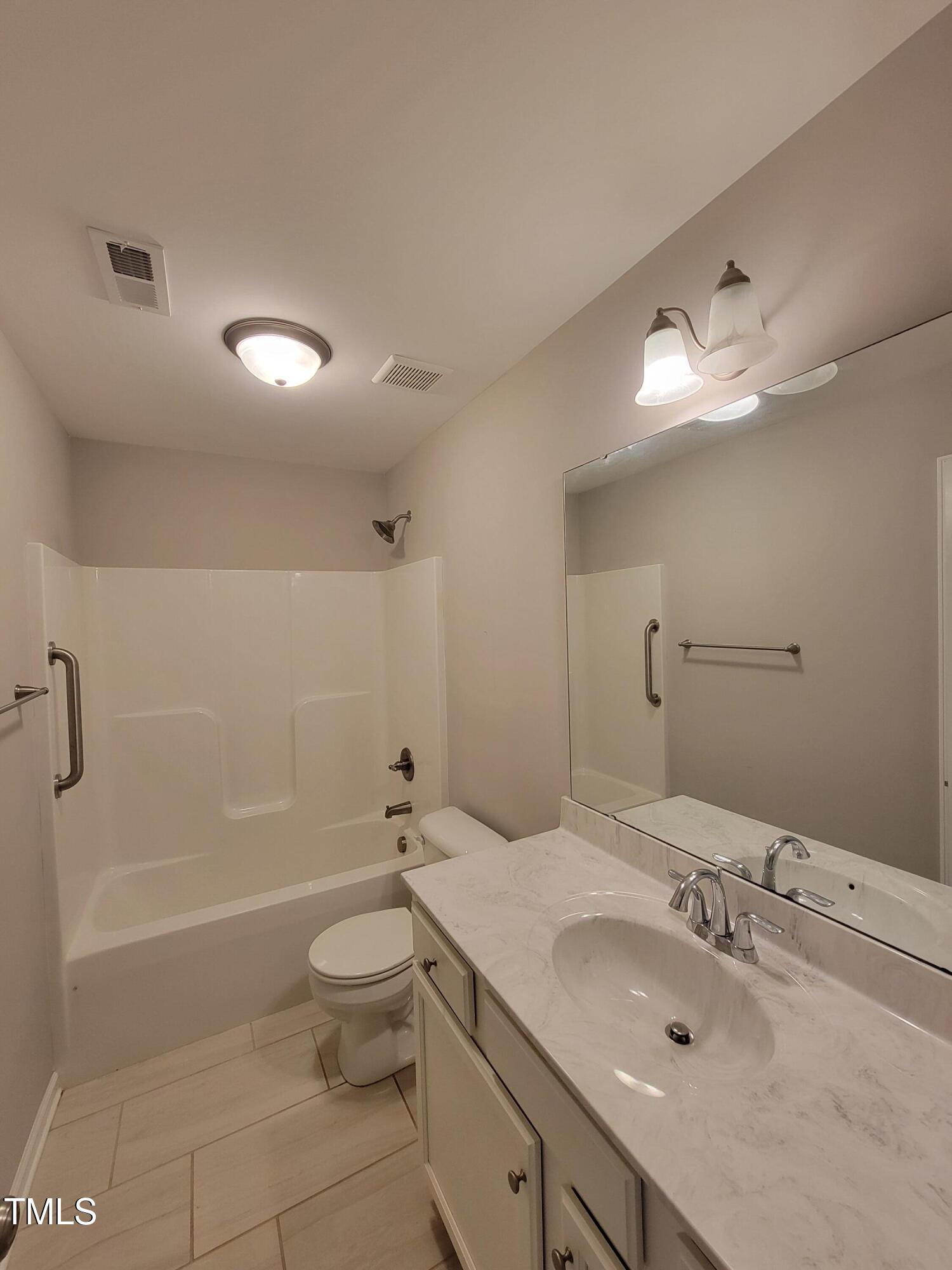 72 Mountain View Drive Garner, NC 27529 - Photo 12 of 22 a bathroom with a sink a toilet and shower
