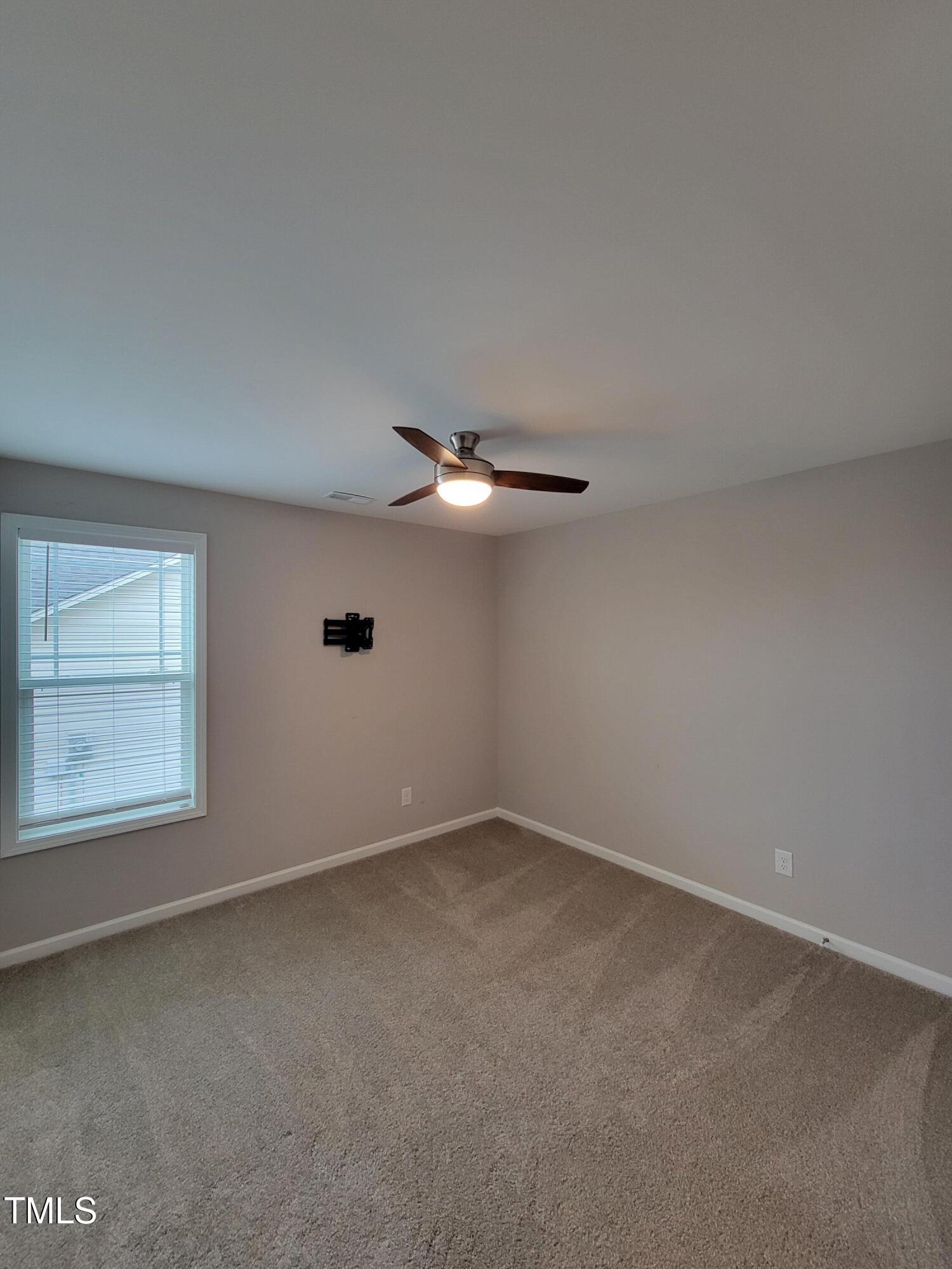 72 Mountain View Drive Garner, NC 27529 - Photo 14 of 22 an empty room with a empty space and windows