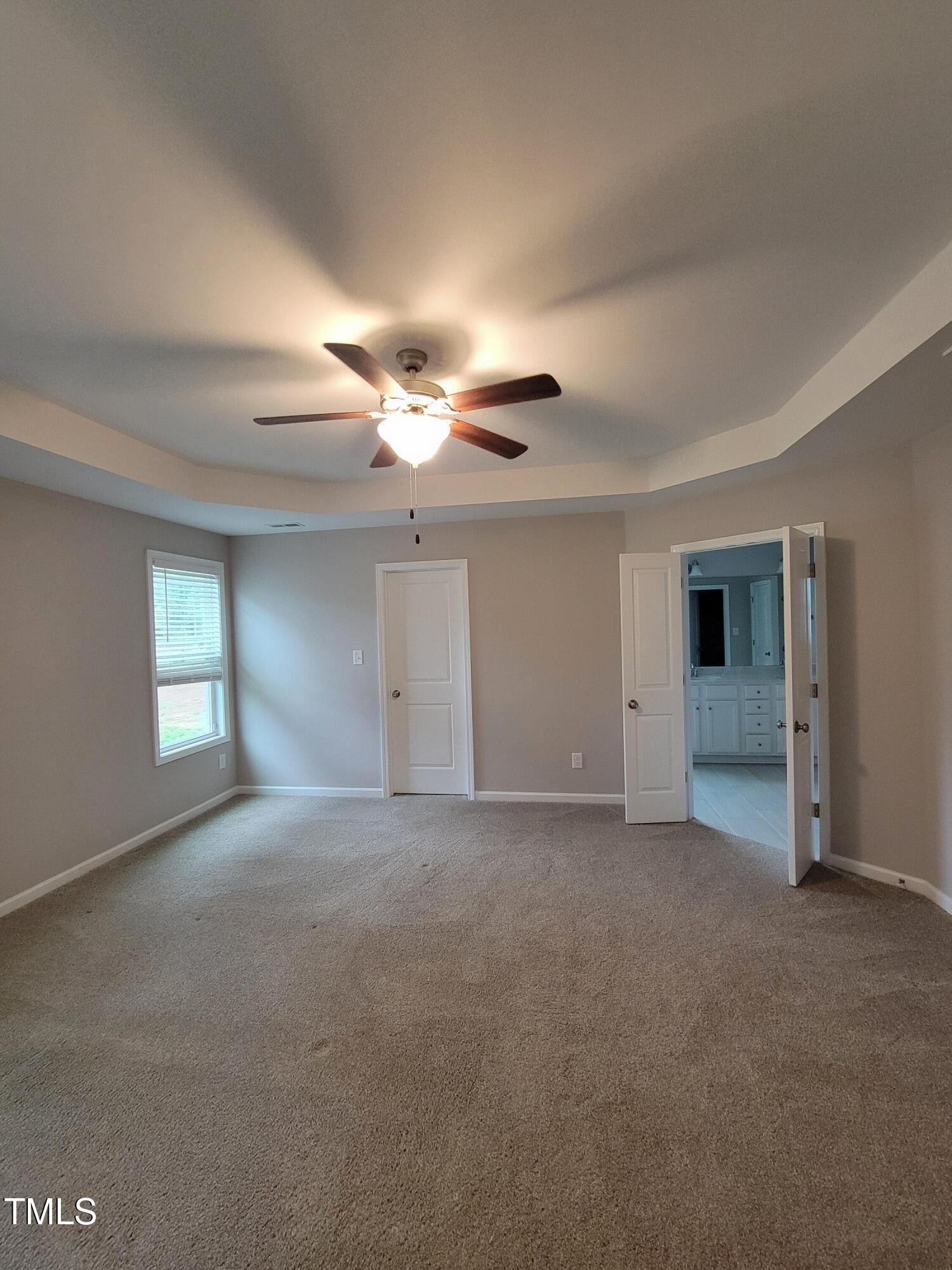 72 Mountain View Drive Garner, NC 27529 - Photo 15 of 22 a view of empty room with window and fireplace