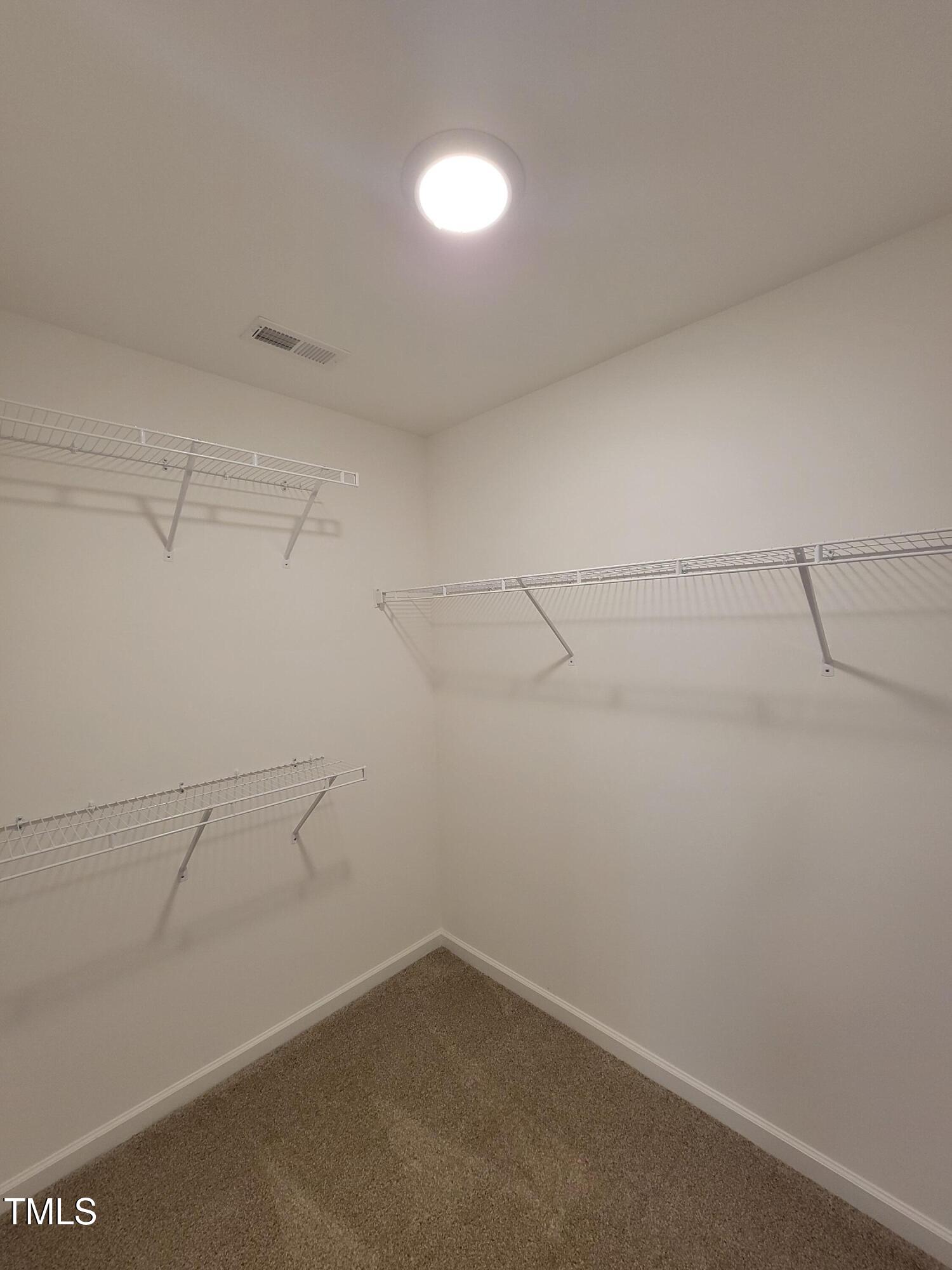 72 Mountain View Drive Garner, NC 27529 - Photo 17 of 22 a view of a room with racks on the wall