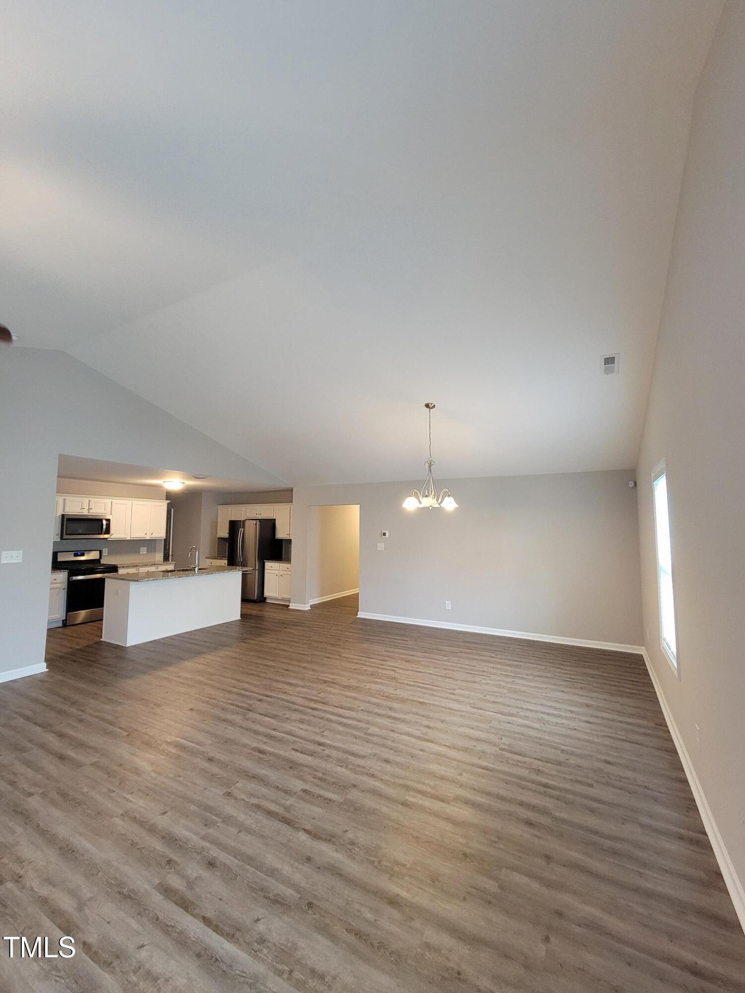 72 Mountain View Drive Garner, NC 27529 - Photo 7 of 22 a view of a kitchen with a sink and a stove top oven