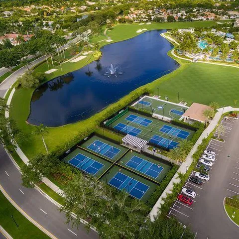 an aerial view of a pool yard patio and lake view