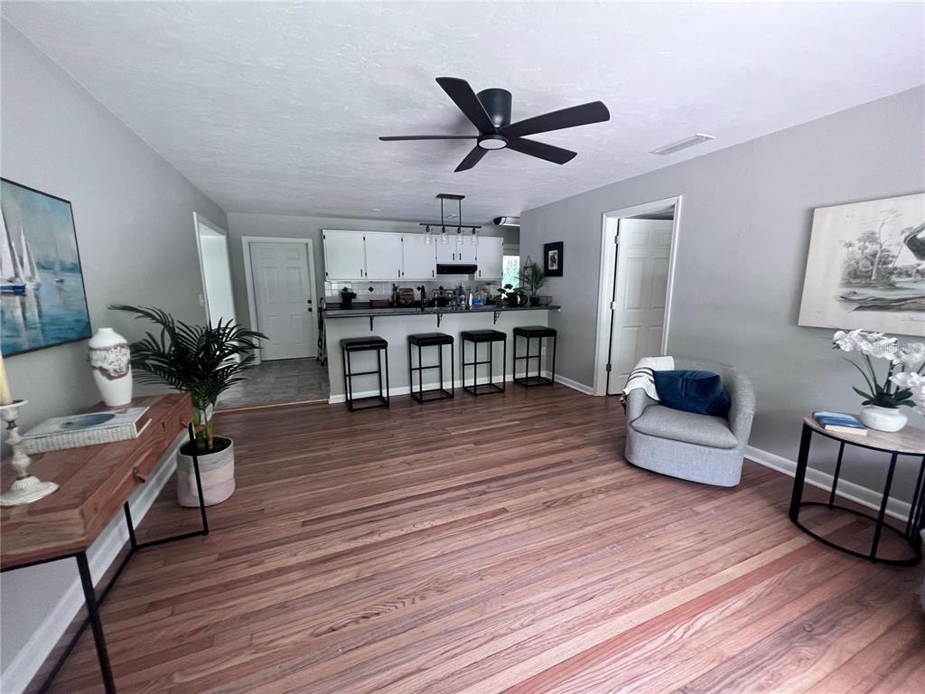 3857 West University Avenue Gainesville, FL 32607 - Photo 14 of 17 a living room with furniture and a wooden floor
