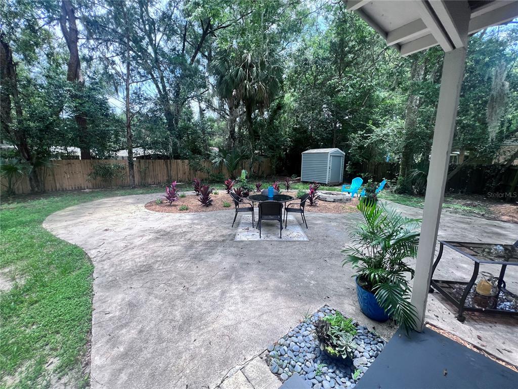 3857 West University Avenue Gainesville, FL 32607 - Photo 7 of 17 a view of a patio with furniture and garden