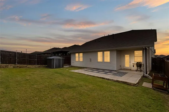a view of a house next to a yard