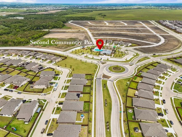 a view of swimming pool with a garden and seating area
