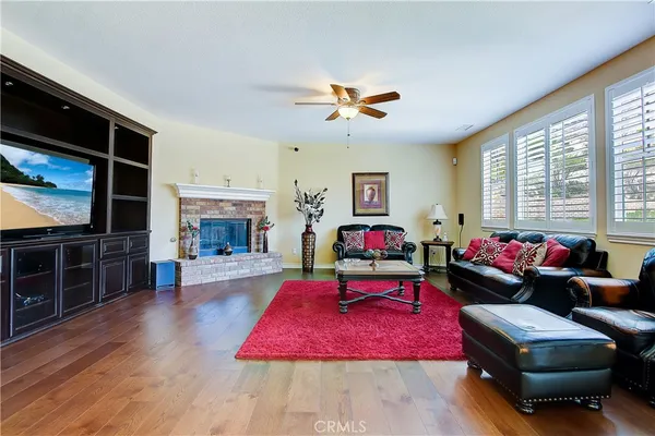 a spacious bedroom with a bed and cabinet