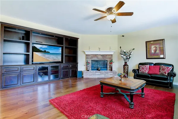 a bedroom with a bed and a couch with large window