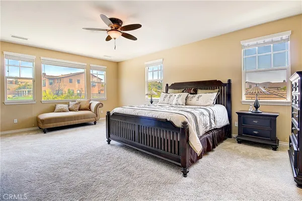 a spacious bathroom with a granite countertop tub sink and mirror