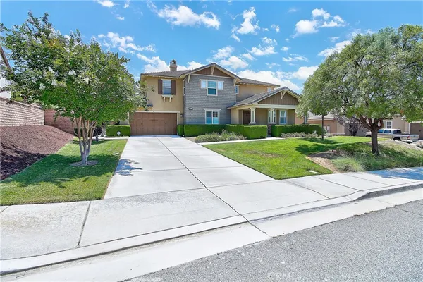 a view of a livingroom with furniture and a window