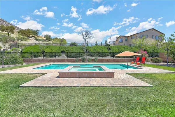 a backyard of a house with lots of green space and outdoor space