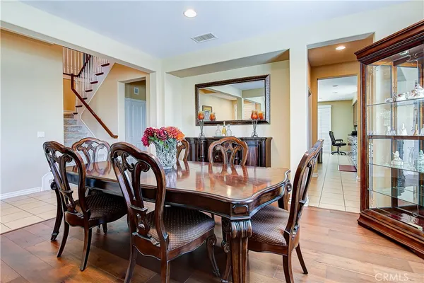 a kitchen with stainless steel appliances kitchen island granite countertop a refrigerator and cabinets
