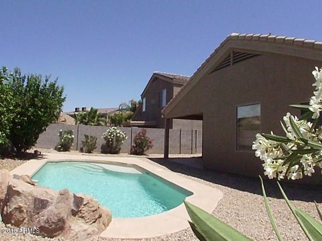 12702 West Boca Raton Road El Mirage, AZ 85335 - Photo 1 of 18 pool toward covered patio