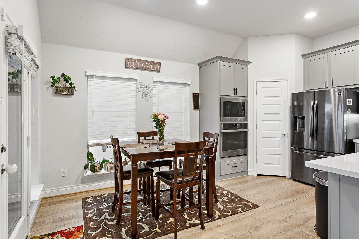 321 Berkeley Place Georgetown, TX 78628 - Photo 12 of 23 a view of a dining room with furniture and a refrigerator
