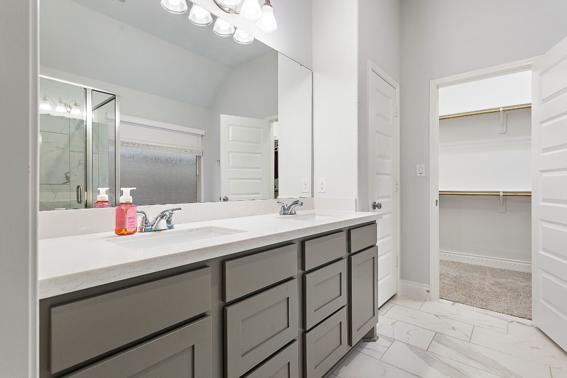 321 Berkeley Place Georgetown, TX 78628 - Photo 15 of 23 a bathroom with a sink and a mirror