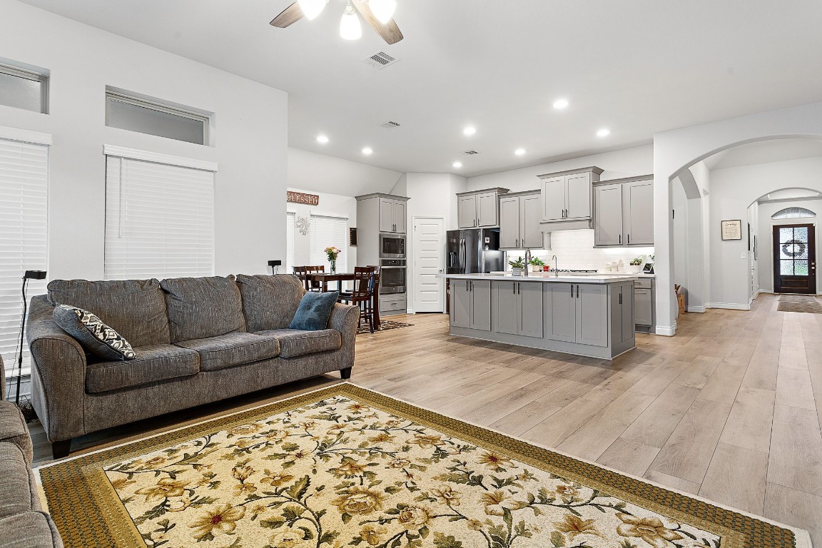 321 Berkeley Place Georgetown, TX 78628 - Photo 4 of 23 a living room with furniture and kitchen view