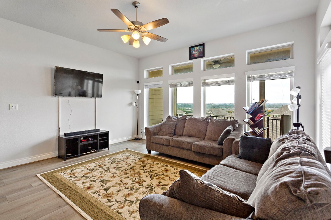 321 Berkeley Place Georgetown, TX 78628 - Photo 6 of 23 a living room with furniture and a flat screen tv