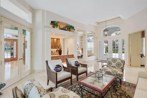 a kitchen with a refrigerator and a stove top oven