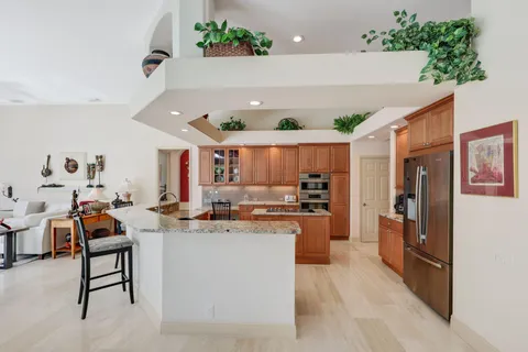 a kitchen with a stove and a cabinets