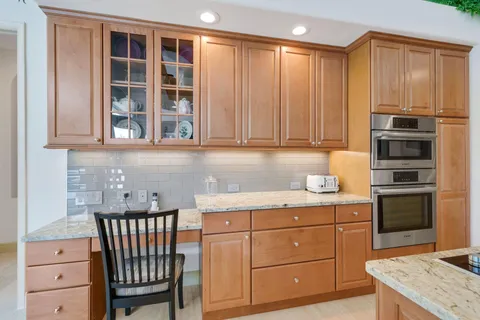 a view of a bathroom with a glass door shower and a mirror