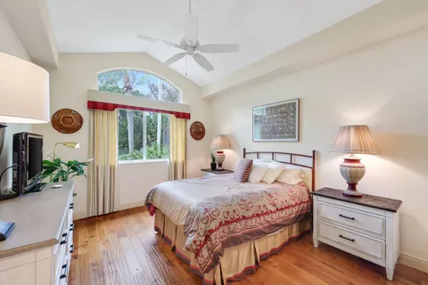 a swimming pool with lots of tress in front of it