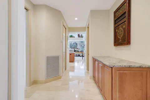 an aerial view of residential houses with outdoor space and lake view