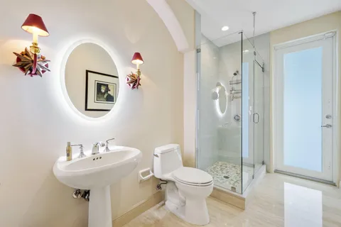 a front view of multiple houses with yard