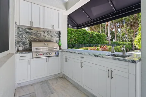 an aerial view of residential house with outdoor space and swimming pool
