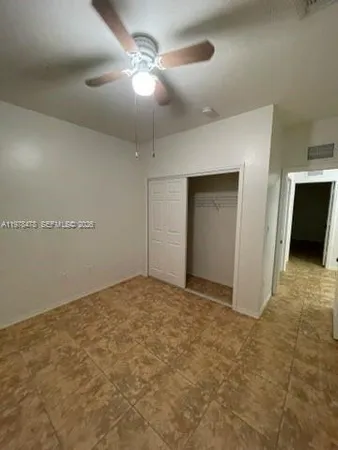 a view of a livingroom with a furniture fan