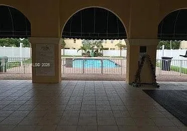a view of a porch with wooden floor