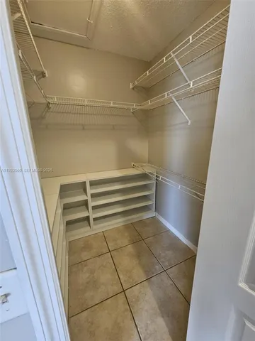 a view of store room with racks on the wall