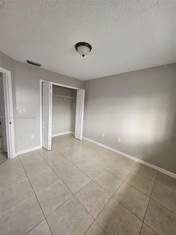 a spacious bathroom with a double vanity sink mirror and toilet