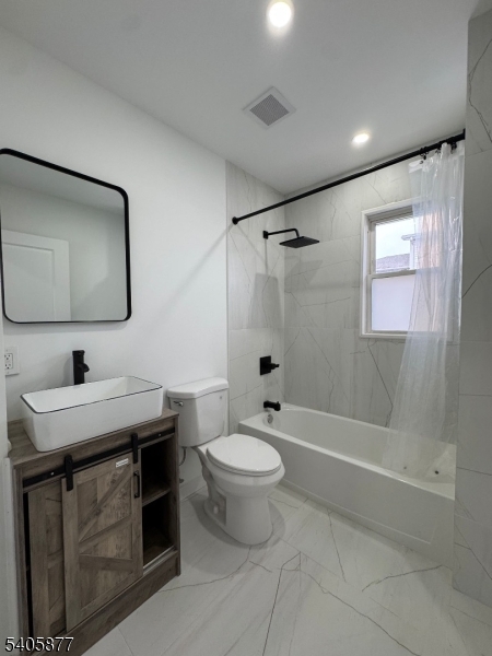 96 Broughton Avenue Bloomfield, NJ 07003 - Photo 11 of 14 a bathroom with a sink toilet and shower