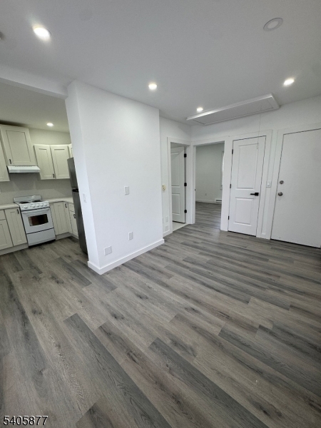 96 Broughton Avenue Bloomfield, NJ 07003 - Photo 4 of 14 a view of a kitchen from a hallway