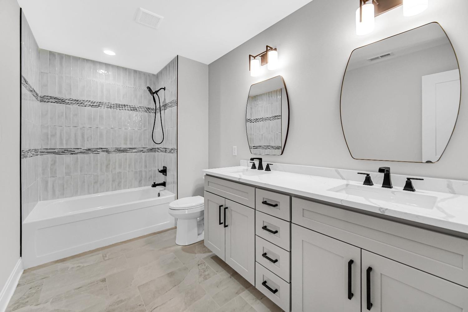 11039 Macedon Street Winfield, IN 46307 - Photo 25 of 36 a bathroom with a double vanity sink mirror double and bathtub