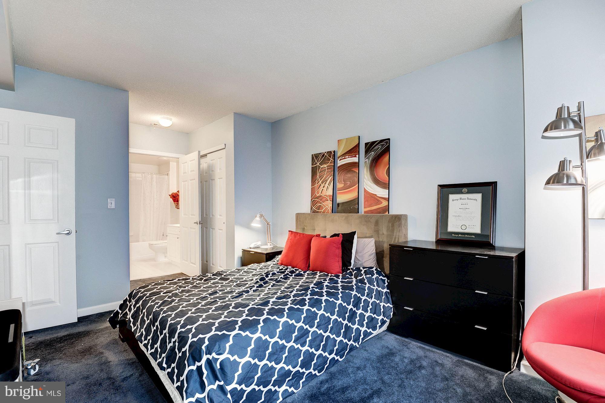 2726 Gallows Road, Unit 1315 Vienna, VA 22180 - Photo 14 of 30 a bedroom with a bed and dresser