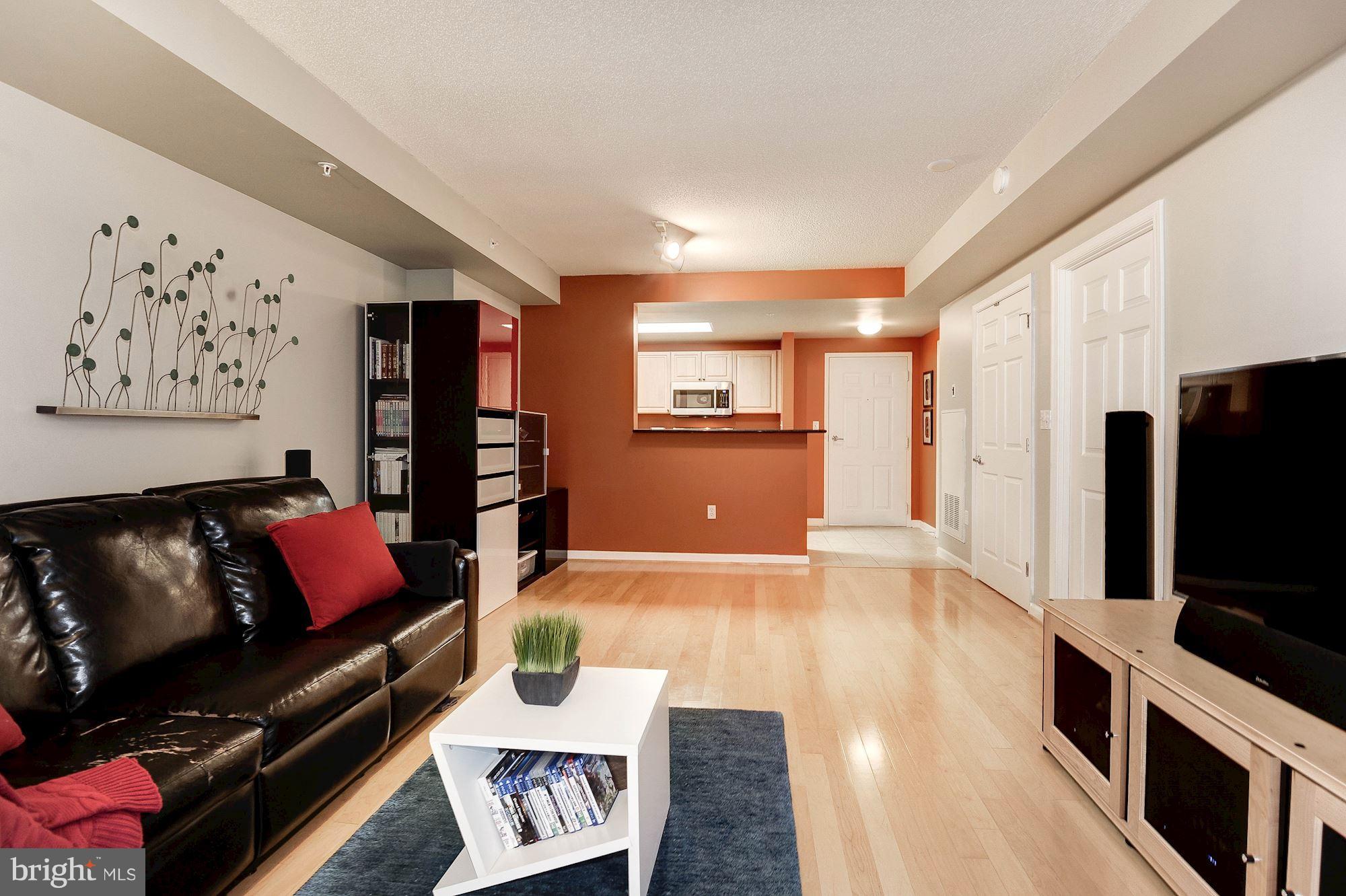 2726 Gallows Road, Unit 1315 Vienna, VA 22180 - Photo 24 of 30 a living room with furniture and a flat screen tv