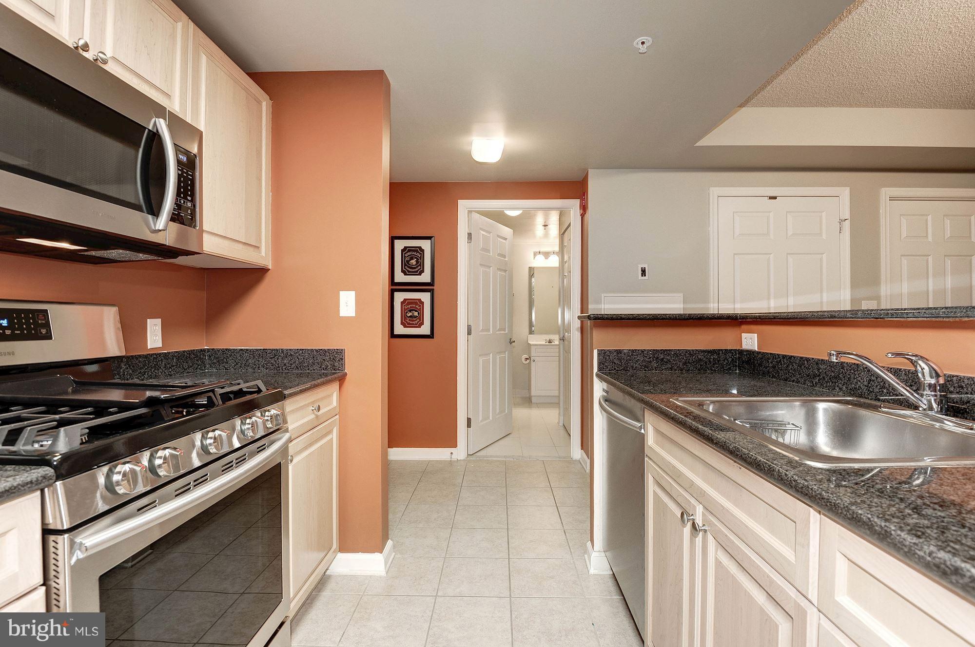 2726 Gallows Road, Unit 1315 Vienna, VA 22180 - Photo 27 of 30 a kitchen that has a sink and a stove
