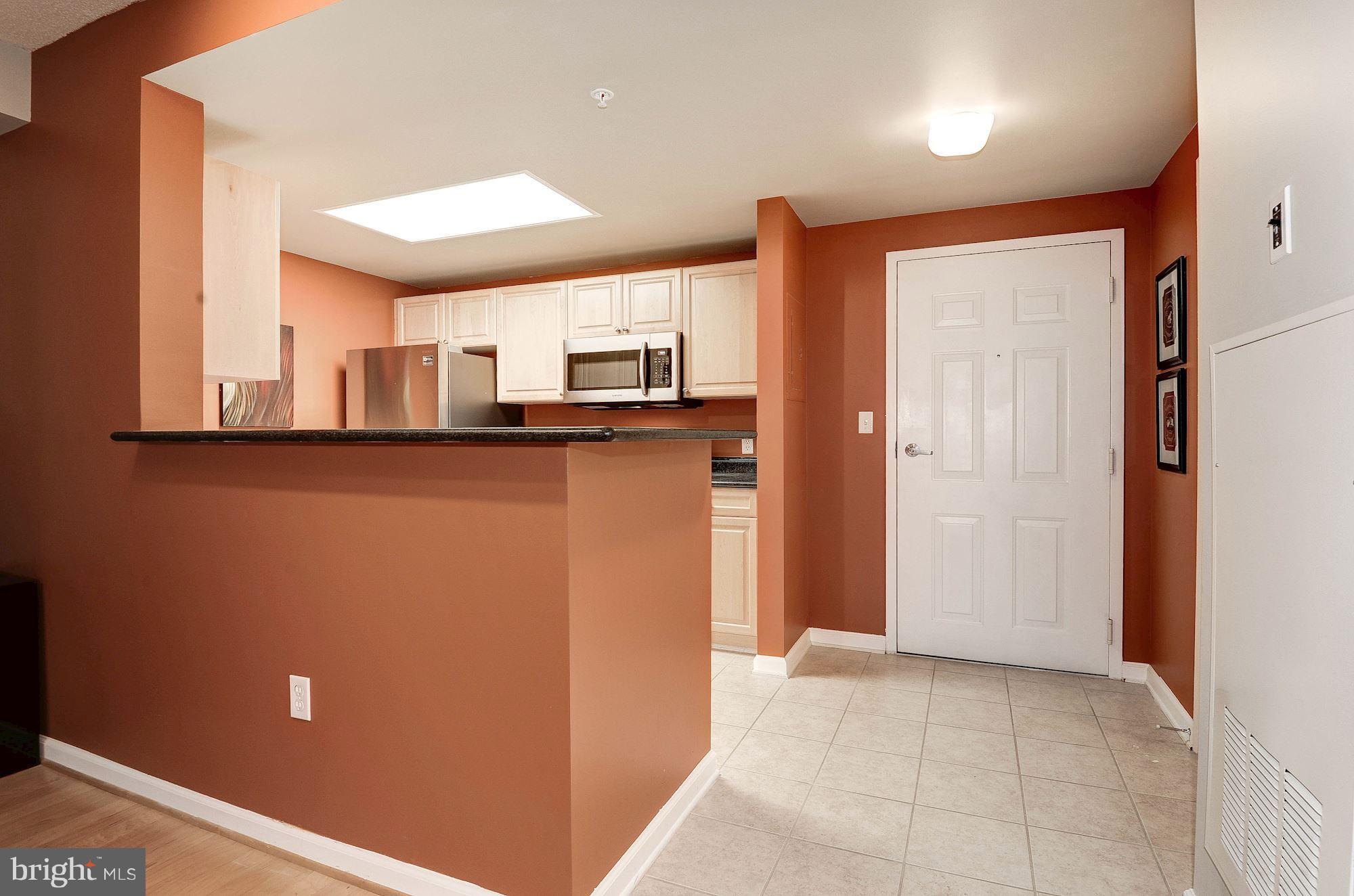 2726 Gallows Road, Unit 1315 Vienna, VA 22180 - Photo 28 of 30 a kitchen with stainless steel appliances a refrigerator and a sink